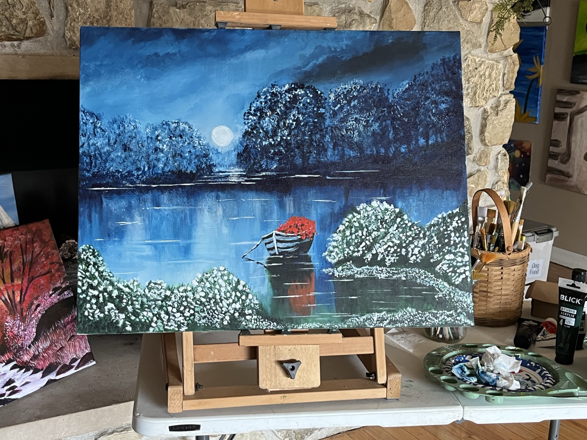 Moonlit Cove — a rowboat with red flowers on a moonlit lake