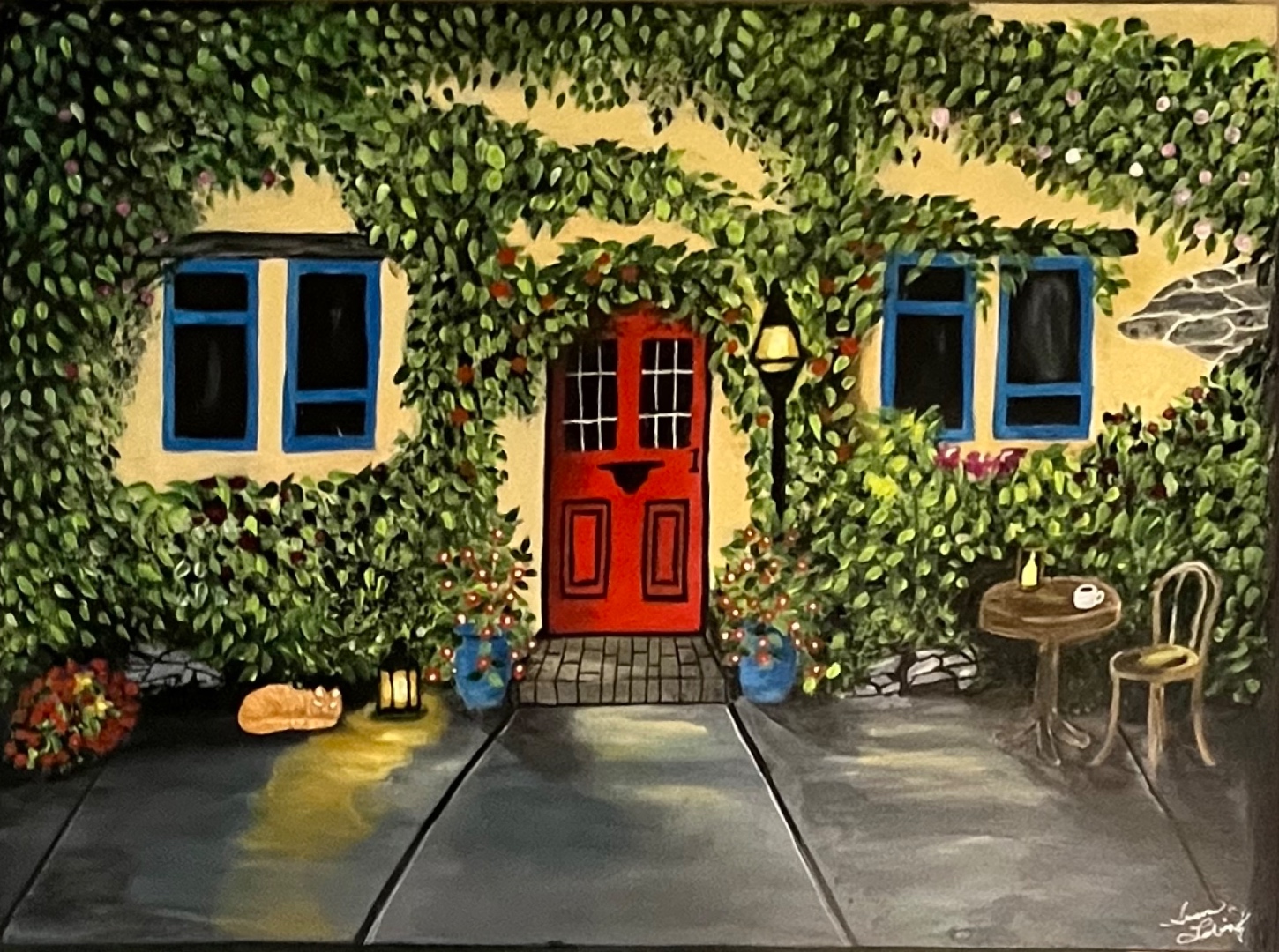 Mr. Kitty — an orange cat resting by a lantern at a ivy-covered cottage door